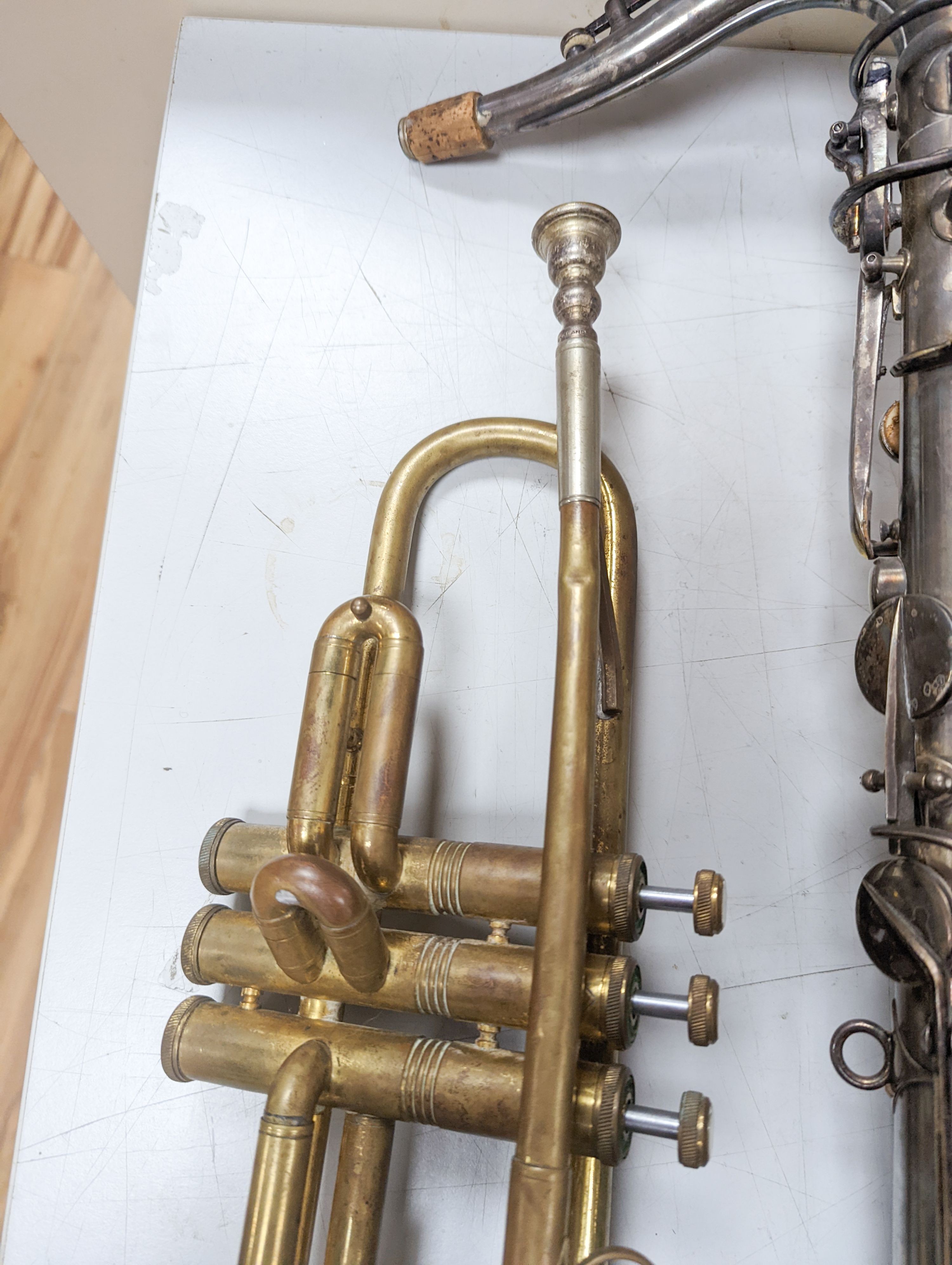 An Excelsior sonorous class A Hawkes & Son saxophone, and a Grafton Dallas, London trumpet with accessories